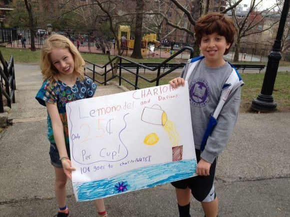 This is a picture of Daniel's brother Darian and Charlotte raising money for Watsi